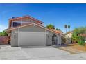 Inviting home with a two-car garage and arched walkway at 3791 El Camino Rd, Las Vegas, NV 89103