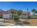 Charming home featuring mature landscaping and an arched walkway at 3791 El Camino Rd, Las Vegas, NV 89103