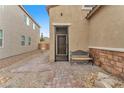 An outdoor area has stone design, a gate to the front door, and a seating bench at 5731 Sedona Springs St, North Las Vegas, NV 89031
