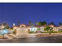 Inviting home featuring mature landscaping, a spacious driveway, and a two-car garage at 7521 Dry Pines Cir, Las Vegas, NV 89129