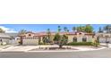 Beautiful single-Gathering home with manicured landscaping, tile roof, and a spacious driveway leading to a two-car garage at 7521 Dry Pines Cir, Las Vegas, NV 89129