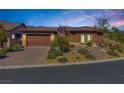 Charming single-story home with a well-manicured front yard and paver driveway at 775 Porto Mio Way, Las Vegas, NV 89138