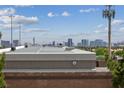 A cityscape view featuring many buildings under a blue sky with scattered clouds at 7950 W Flamingo Rd # 2066, Las Vegas, NV 89147