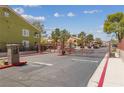 Gated residential community entrance with guest and resident lanes, ensuring security and controlled access at 7950 W Flamingo Rd # 2066, Las Vegas, NV 89147