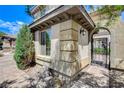 Close-up of the home's stone and stucco exterior with an arched entryway at 8212 Swallow Falls St, North Las Vegas, NV 89085