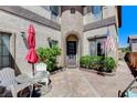 Inviting front patio with outdoor seating and mature landscaping details at 8212 Swallow Falls St, North Las Vegas, NV 89085