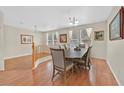 Formal dining room featuring a large table, wood floors, and a stylish chandelier at 9009 Ochoa St, Las Vegas, NV 89143