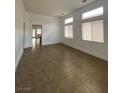 Bright living room with tile flooring and large windows at 9839 Brook Canyon Dr, Las Vegas, NV 89147