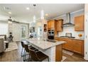 Beautiful kitchen featuring granite countertops, stainless steel appliances and stylish pendant lighting at 9953 Fletcher Peak Ave, Las Vegas, NV 89178