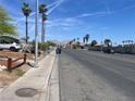 Wide residential street lined with palm trees and mountain views offering a tranquil suburban setting at , North Las Vegas, NV 89030