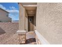 Inviting front porch featuring stone accents, a decorative wreath, and a tiled walkway at , North Las Vegas, NV 89031