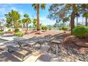 Community amenities featuring a picnic table and grill, perfect for outdoor gatherings and barbecues at 1000 Grammy Dr, Las Vegas, NV 89145