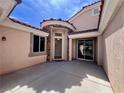 The home's entrance features a stone accent and a private courtyard area with tile roofing at 1963 Dakota Lodge Ave, Las Vegas, NV 89123