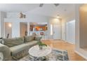 Bright living space featuring an open layout, comfortable seating, and seamless flow to kitchen and entryway at 2325 Windmill Pkwy # 323, Henderson, NV 89074