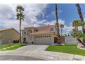 Charming home with desert landscaping, mature palm trees, and a well-maintained front yard at 3005 Stern Dr, Las Vegas, NV 89117