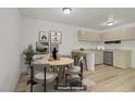 Dining area with round table, seating for four, and adjacent kitchen space at 304 Orland St # 47, Las Vegas, NV 89107