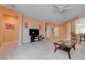 Spacious living room with tile flooring, neutral walls, and ample natural light at 4140 Gliding Gulls Ave, North Las Vegas, NV 89084
