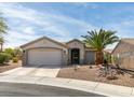 Charming single-story home with a two car garage and desert landscaping at 435 Piute Valley Ct, Henderson, NV 89012