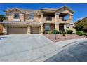 A beautiful home featuring a three-car garage, meticulously maintained landscaping and a lengthy driveway at 5808 Amber Station Ave, Las Vegas, NV 89131