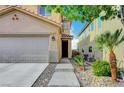 Welcoming home entrance with a step-up walkway, landscaped yard, and an inviting front door at 722 Chepstow Ave, Las Vegas, NV 89178