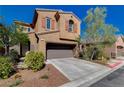 Charming two-story home features a well-maintained front yard, a two-car garage, and desert landscaping at 7613 Pulpit Rock Ct, Las Vegas, NV 89166