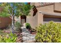 Inviting front entrance with a well-manicured yard and charming walkway leading to the front door at 7613 Pulpit Rock Ct, Las Vegas, NV 89166