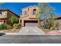 Charming two-story home with a two-car garage, desert landscaping, and a well-maintained front yard at 7613 Pulpit Rock Ct, Las Vegas, NV 89166