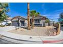 Well-maintained single-story home featuring desert landscaping, a three-car garage, and a welcoming entrance at 8080 Black Orchid Ave, Las Vegas, NV 89131