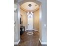 Inviting entryway with tiled floor, decorative medallion, and chandelier at 9077 Creed Mountain Pl, Las Vegas, NV 89178