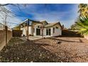Spacious backyard with a patio and minimalist landscaping, perfect for outdoor living at 10404 Shadowland Ave, Las Vegas, NV 89144