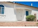Bright and welcoming front entrance with a classic white door and desert landscaping at 10404 Shadowland Ave, Las Vegas, NV 89144