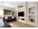 Comfortable living room with built-in shelving and entertainment center at 1153 Mesa Verde Run, Mesquite, NV 89027
