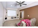 Cozy theater room with projector screen and comfortable seating at 1153 Mesa Verde Run, Mesquite, NV 89027