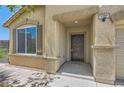 Close up of the front door and tiled entry way, and the home address number at 1197 Bear Head St, Henderson, NV 89011