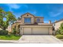 Charming two-story home featuring a three-car garage and well-maintained landscaping at 13 Cozy Glen Cir, Henderson, NV 89074