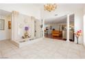 Grand foyer with tiled floors, a decorative fountain, and elegant columns leading into the living spaces at 2255 S Buffalo Dr, Las Vegas, NV 89117