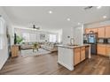 Open-concept living space featuring hardwood floors, natural light, and modern finishes at 2885 Timber Country Rd, North Las Vegas, NV 89086