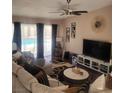 Comfortable living room with a ceiling fan and hardwood floors at 3920 Autumn St, Las Vegas, NV 89120