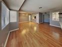 Bright living room featuring hardwood floors, a fireplace, and views into the kitchen at 5043 Spencer St # A, Las Vegas, NV 89119