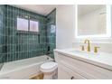 Charming bathroom with tub, shower and a vanity with gold fixtures at 5239 Elgin Cir, Las Vegas, NV 89122
