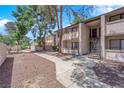 Exterior condo with landscaping, a walkway, and stairs leading to the upper units at 5241 Janfred Ct # 26, Las Vegas, NV 89103