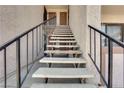 Stairway leading up to second-story condos shows sturdy construction and metal handrails at 5241 Janfred Ct # 26, Las Vegas, NV 89103