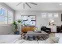 Cozy living room with a large sectional, modern furniture, and neutral decor at 5918 Peridot Falls Ave, Las Vegas, NV 89130