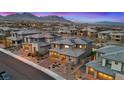 Stunning aerial view of the home with solar panels, surrounded by lush landscaping and mountain views at 754 Spirit Lake St, Las Vegas, NV 89138