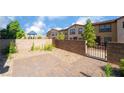 Cozy patio area with interlocking brick pavers and a gated backyard, perfect for outdoor enjoyment at 756 Sleeping City Ave, Henderson, NV 89015
