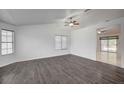 Spacious living room with hardwood floors, lots of natural light, and vaulted ceilings at 7898 Rye Canyon Dr, Las Vegas, NV 89123