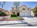 Charming two-story home with a well-maintained lawn and a two-car garage at 901 Sir Winston St, Henderson, NV 89052
