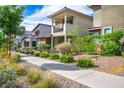 Lovely street view featuring modern homes with balconies, complemented by well-kept landscaping at 1000 E Sunset Rd, Henderson, NV 89011