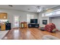 Living room boasts wood floors, fireplace, and access to the backyard at 1048 Painted Daisy Ave, Henderson, NV 89074
