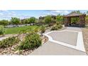 Community outdoor picnic pavilion with lush landscaping provides a great area to relax at 12254 Cape Cortez Ct, Las Vegas, NV 89138